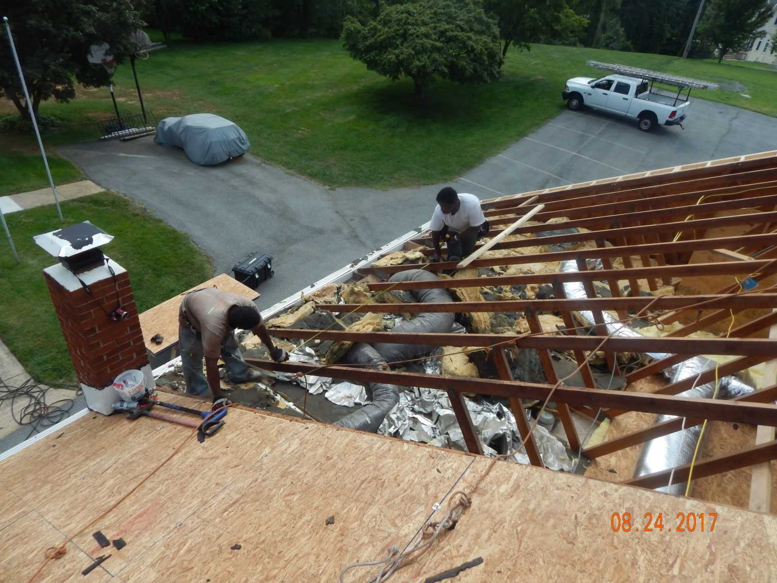 Roofers replacing church roof deck